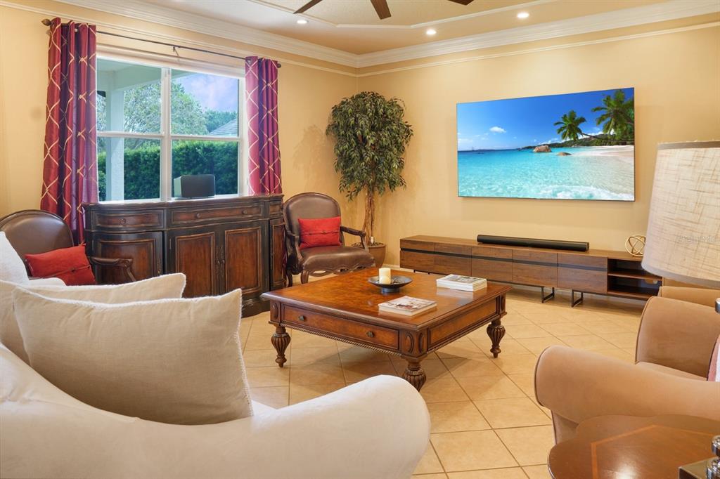 124 Spring Glen Drive DeBary, FL 32713 - Photo 16 of 40 a living room with furniture and a flat screen tv