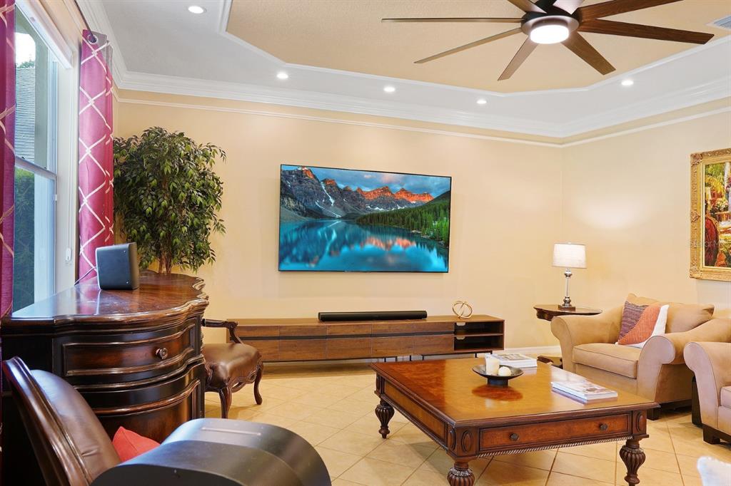 124 Spring Glen Drive DeBary, FL 32713 - Photo 18 of 40 a living room with furniture and a flat screen tv