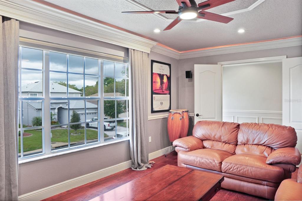 124 Spring Glen Drive DeBary, FL 32713 - Photo 22 of 40 a living room with furniture and a large window