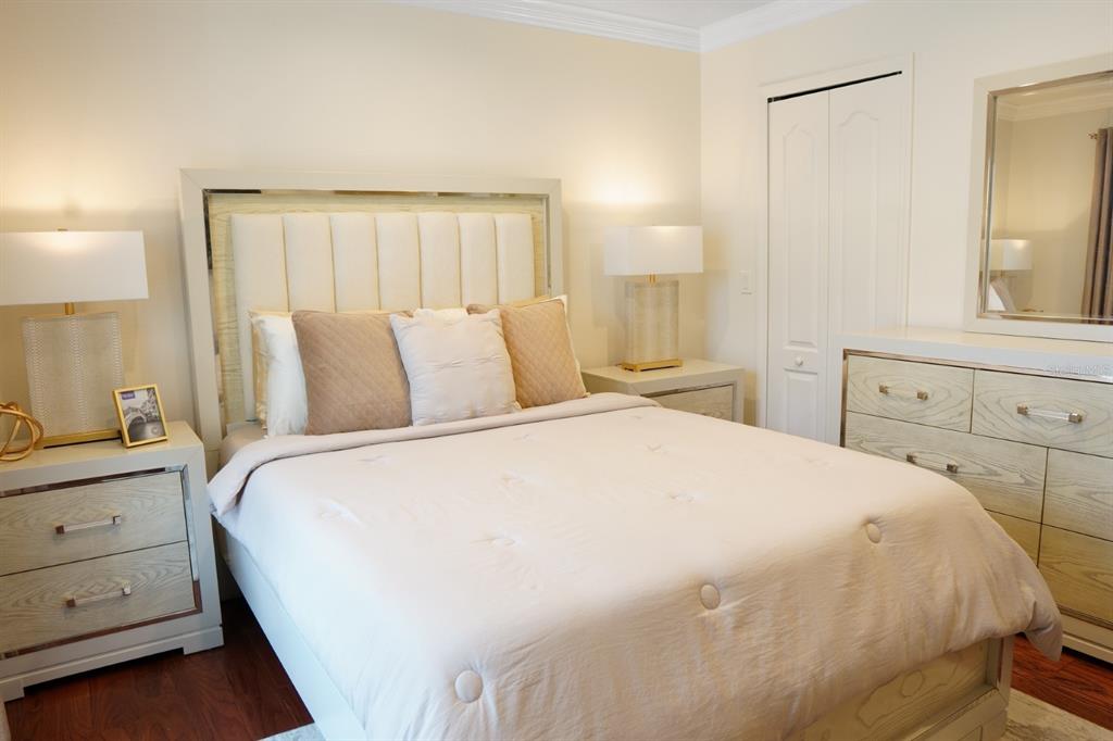 124 Spring Glen Drive DeBary, FL 32713 - Photo 24 of 40 a bedroom with a large bed and a dresser