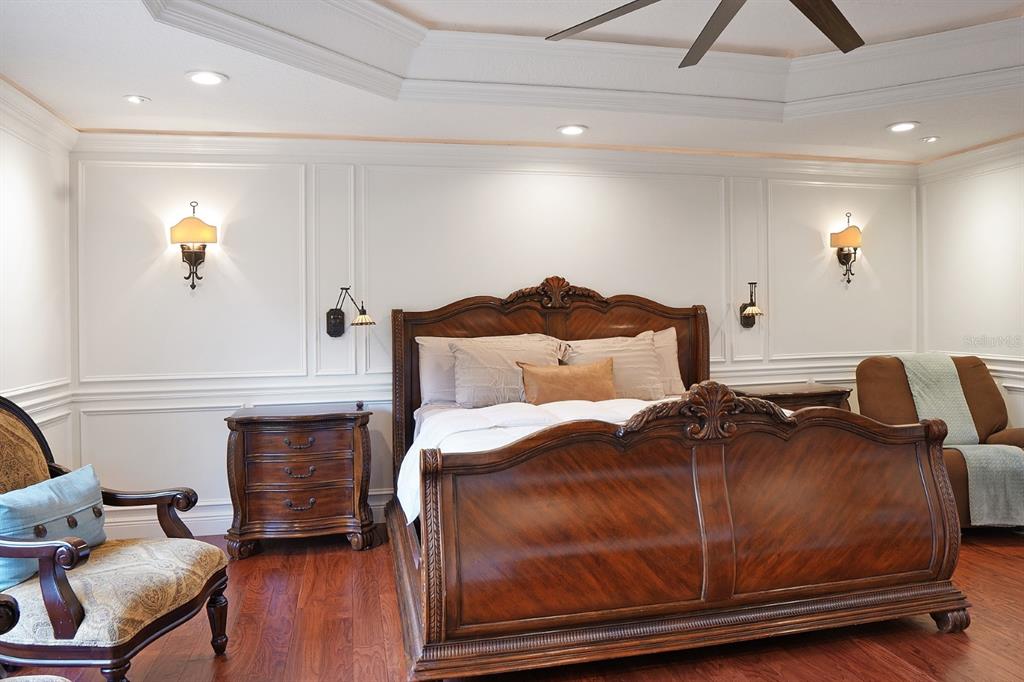 124 Spring Glen Drive DeBary, FL 32713 - Photo 28 of 40 a bedroom with a bed and a potted plant on the dresser