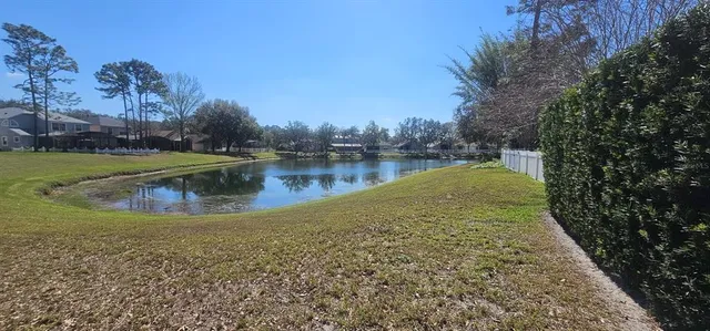 a view of a swimming pool with a patio