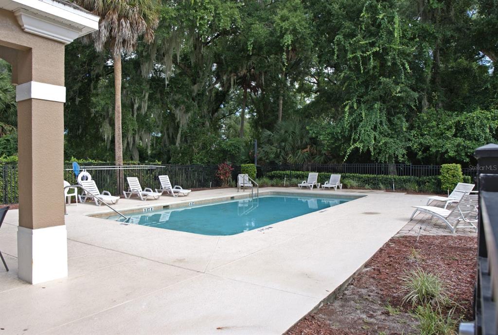 124 Spring Glen Drive DeBary, FL 32713 - Photo 38 of 40 a view of a swimming pool with a patio