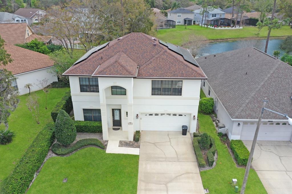 124 Spring Glen Drive DeBary, FL 32713 - Photo 4 of 40 an aerial view of a house with a yard