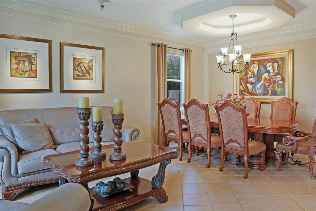 124 Spring Glen Drive DeBary, FL 32713 - Photo 6 of 40 a view of a dining room with furniture and chandelier