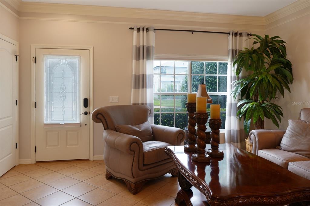 124 Spring Glen Drive DeBary, FL 32713 - Photo 7 of 40 a living room with furniture and a potted plant