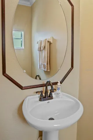 a bathroom with a sink and mirror