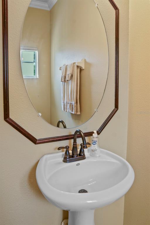 124 Spring Glen Drive DeBary, FL 32713 - Photo 8 of 40 a bathroom with a sink and mirror
