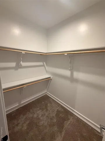 a view of an empty walk in closet
