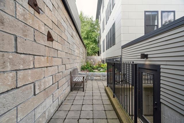 a view of a house with a door and a gate