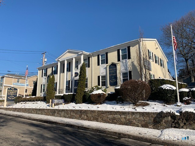 a front view of a building with street view