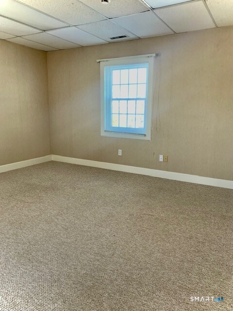 4666 Main Street, Unit 2B Bridgeport, CT 06606 - Photo 11 of 16 an empty room with windows