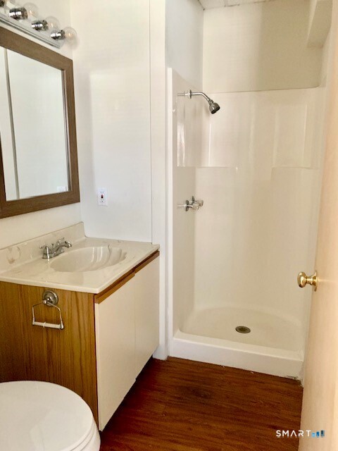 4666 Main Street, Unit 2B Bridgeport, CT 06606 - Photo 12 of 16 a bathroom with a sink and a mirror