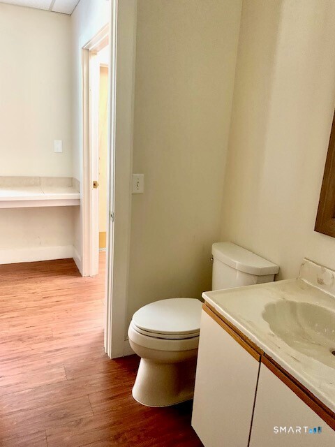 4666 Main Street, Unit 2B Bridgeport, CT 06606 - Photo 13 of 16 a bathroom with a sink and a toilet