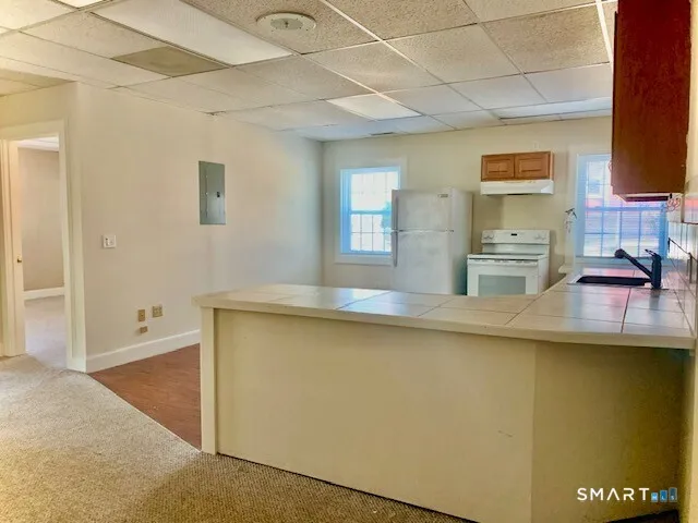 a kitchen with a sink and cabinets