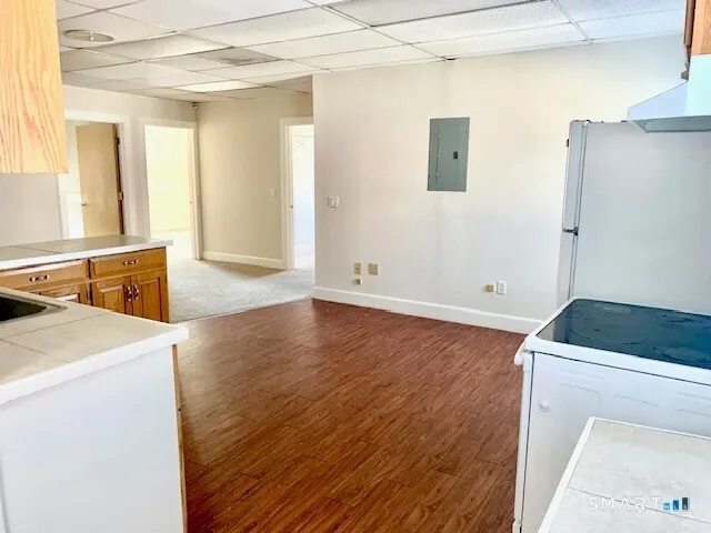 a room with a sink and a wooden floor