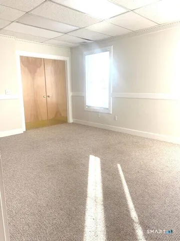 a view of a room that has a window in it