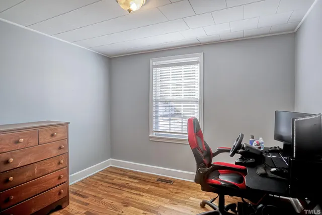 a workspace with furniture and a window