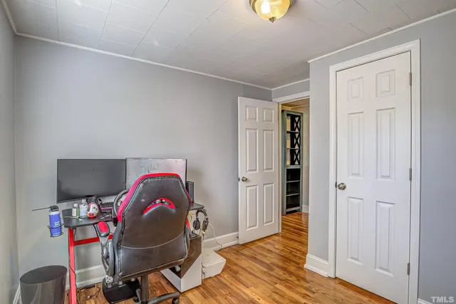 a workspace with furniture and wooden floor