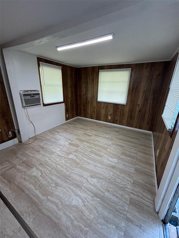 3414 Dr Love Road, Unit C Orlando, FL 32810 - Photo 3 of 9 a view of an empty room with window and wooden floor