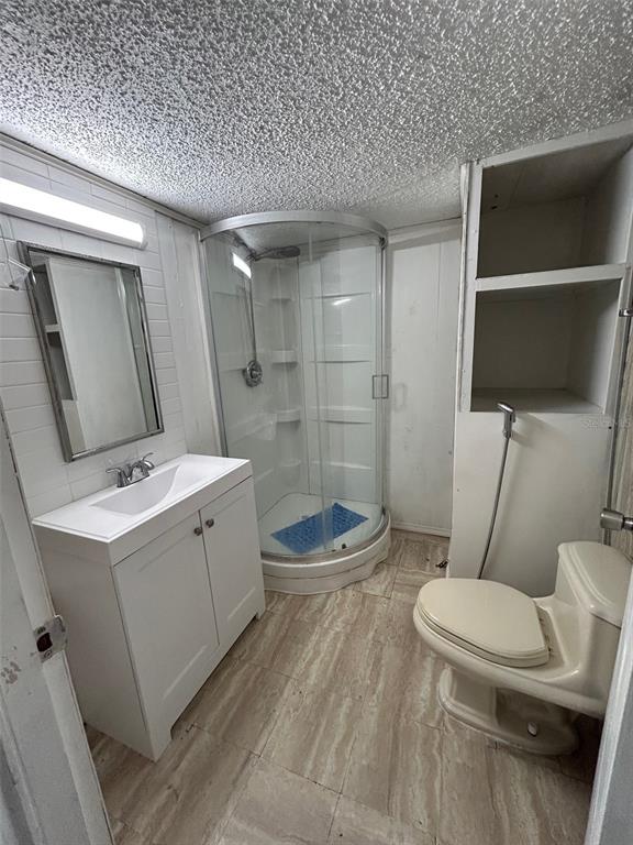 3414 Dr Love Road, Unit C Orlando, FL 32810 - Photo 8 of 9 a bathroom with a sink a toilet and shower