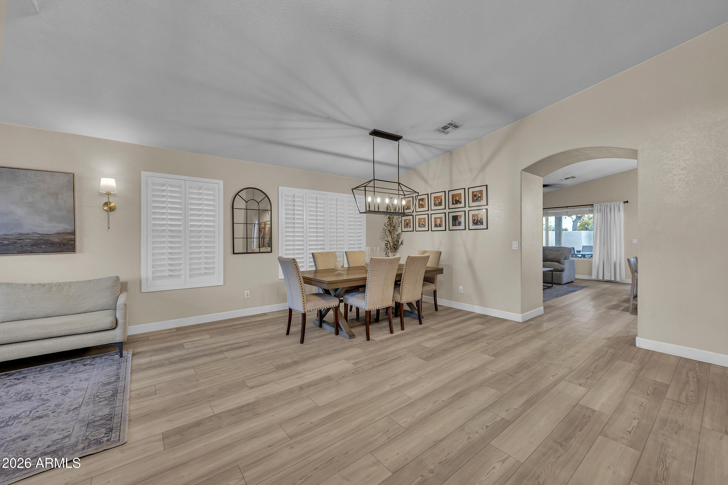 4629 East Gold Poppy Way Phoenix, AZ 85044 - Photo 12 of 46 a view of a livingroom with furniture and window