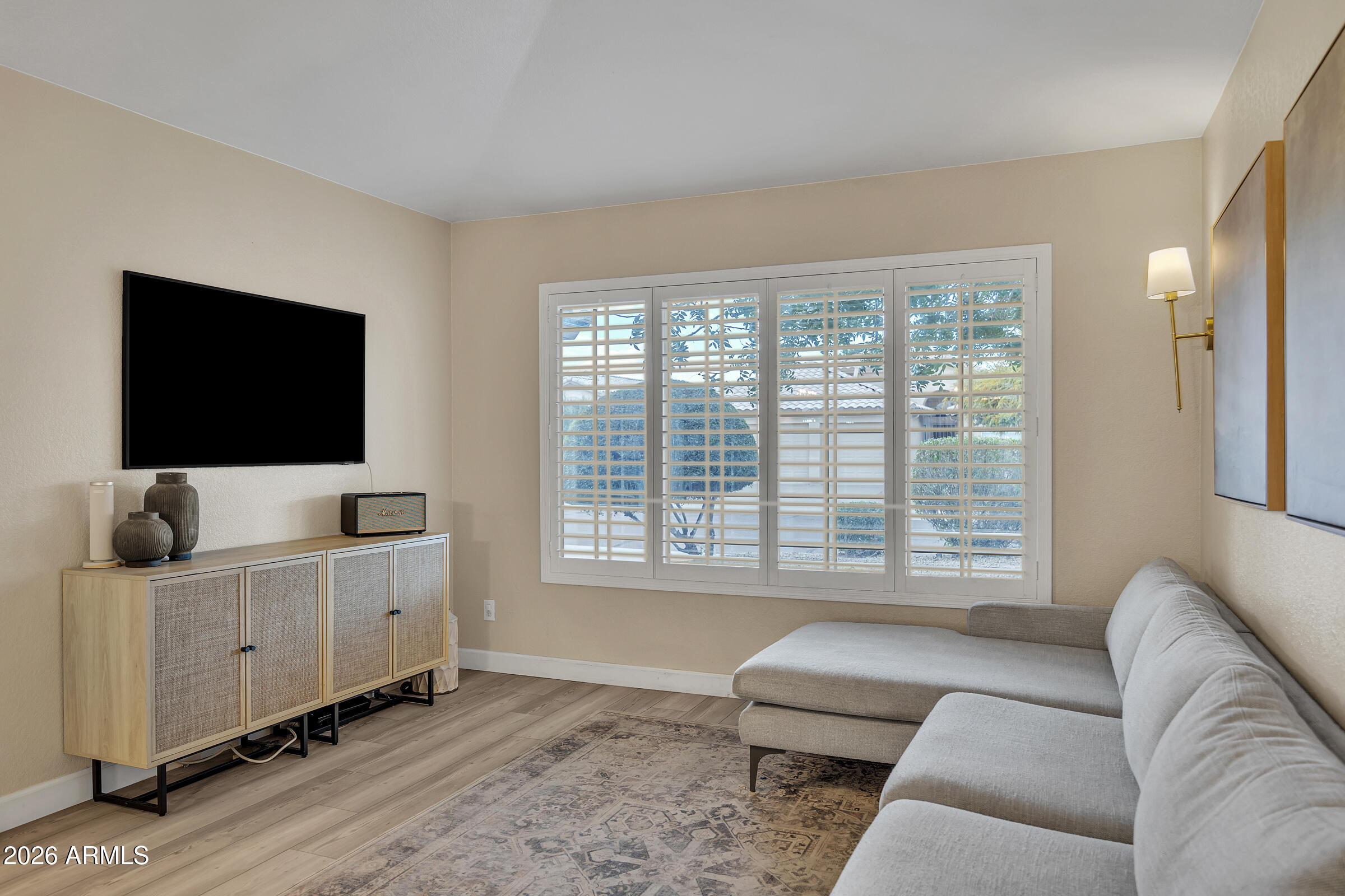4629 East Gold Poppy Way Phoenix, AZ 85044 - Photo 13 of 46 a living room with furniture and a flat screen tv
