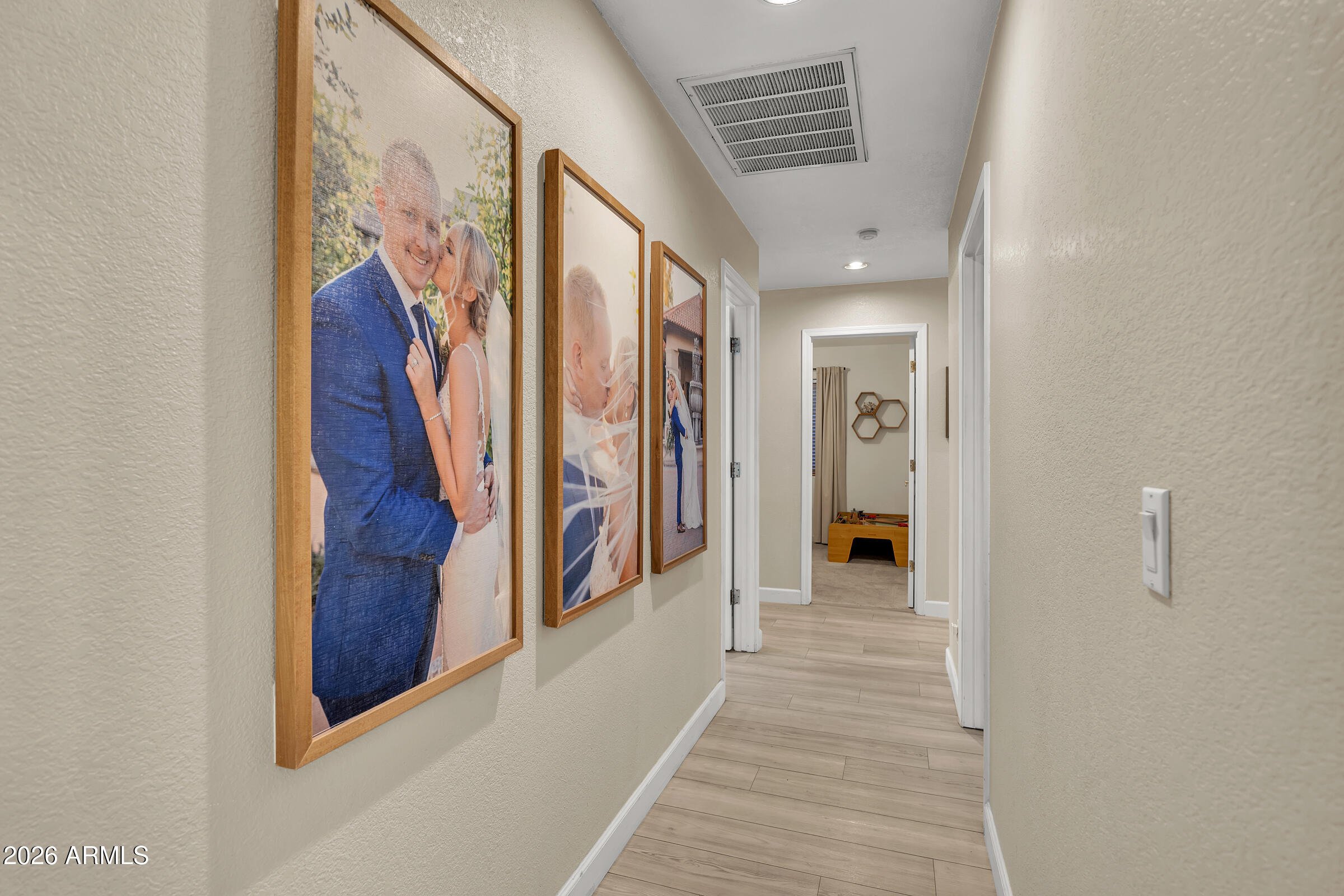 4629 East Gold Poppy Way Phoenix, AZ 85044 - Photo 15 of 46 a view of a hallway with wooden floor and stairs