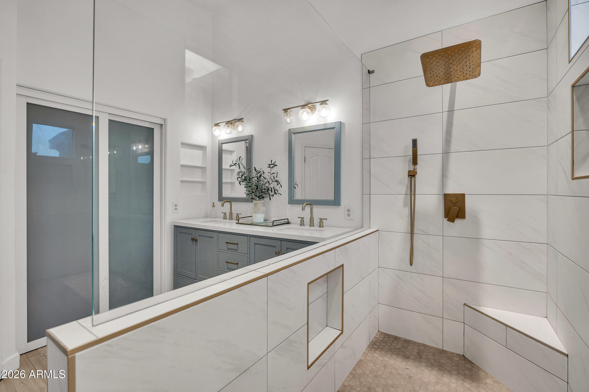 4629 East Gold Poppy Way Phoenix, AZ 85044 - Photo 18 of 46 a bathroom with a double vanity sink a mirror and a shower