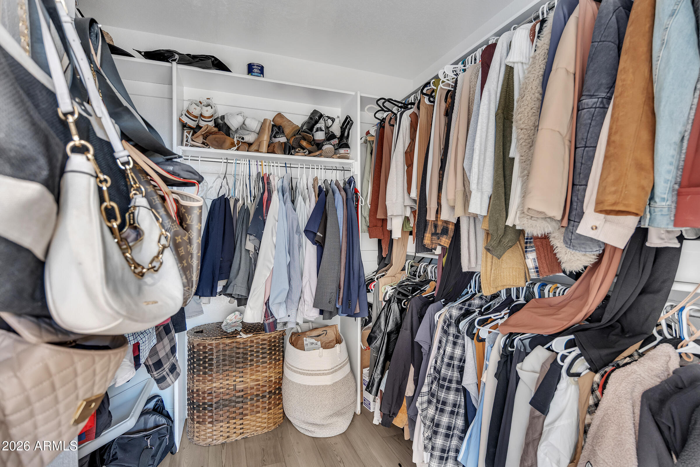 4629 East Gold Poppy Way Phoenix, AZ 85044 - Photo 19 of 46 a view of walk in closet with clothes and shoes