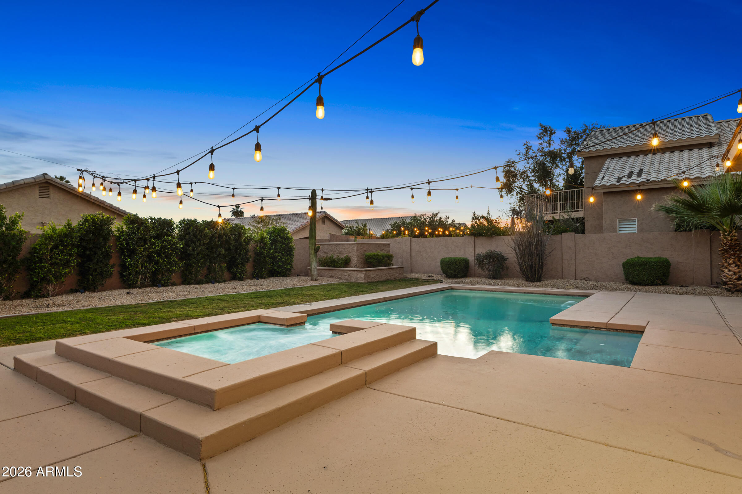 4629 East Gold Poppy Way Phoenix, AZ 85044 - Photo 2 of 46 a view of a swimming pool with a patio and a yard