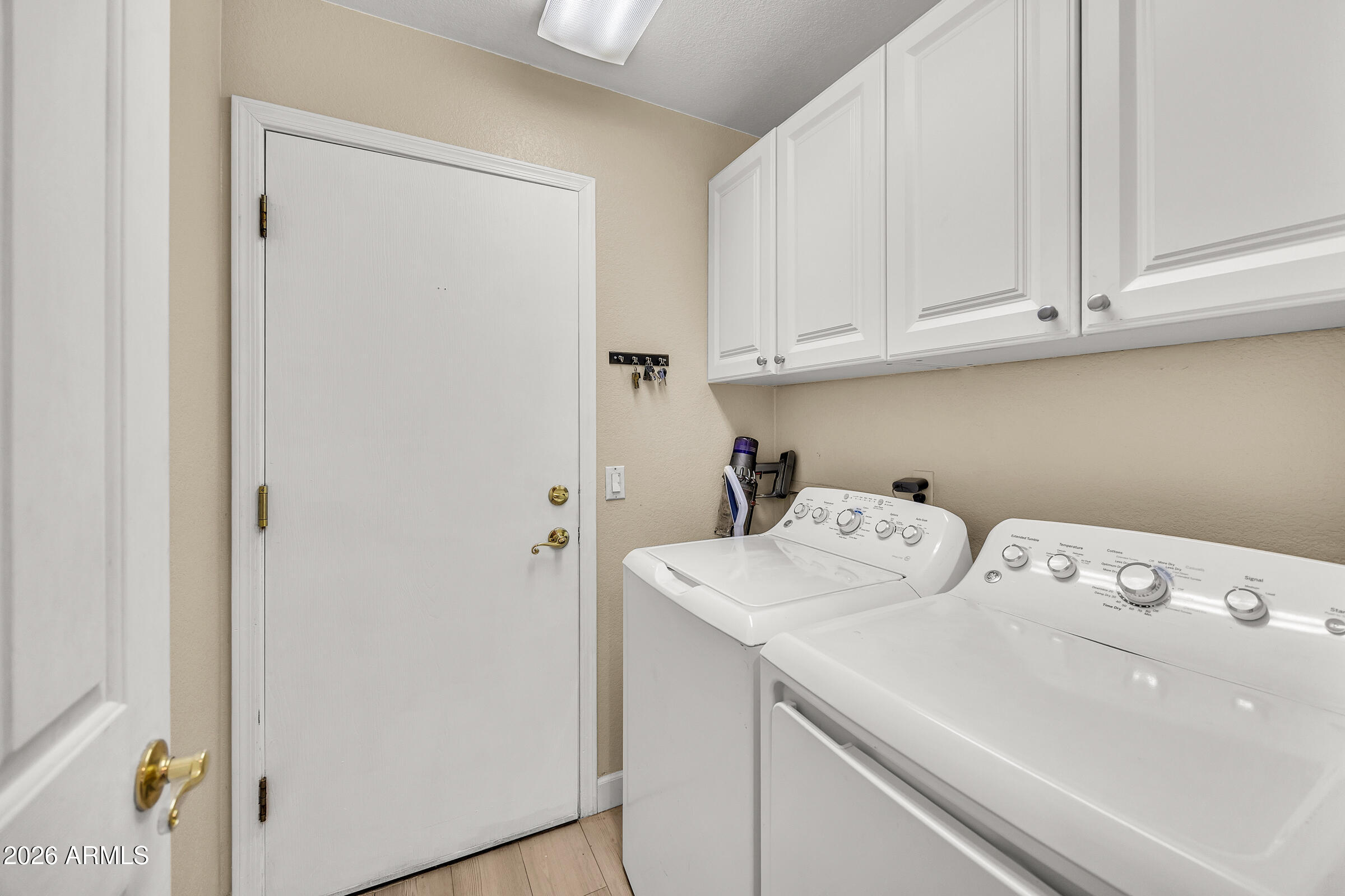 4629 East Gold Poppy Way Phoenix, AZ 85044 - Photo 25 of 46 a utility room with dryer and washer