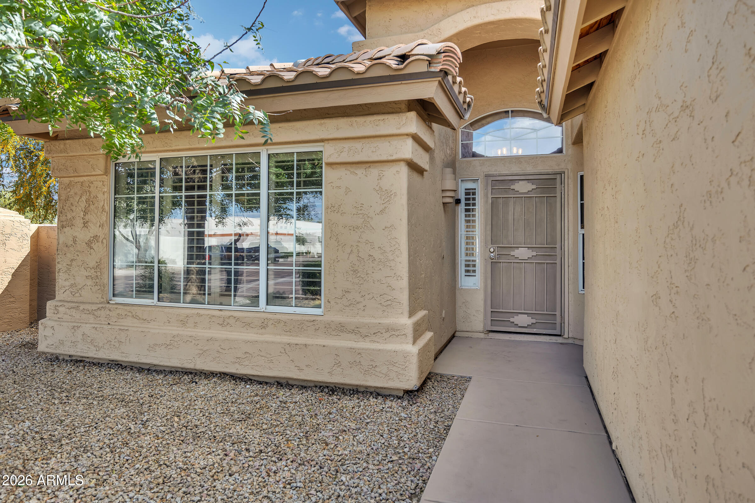 4629 East Gold Poppy Way Phoenix, AZ 85044 - Photo 38 of 46 a view of a house with a wooden deck