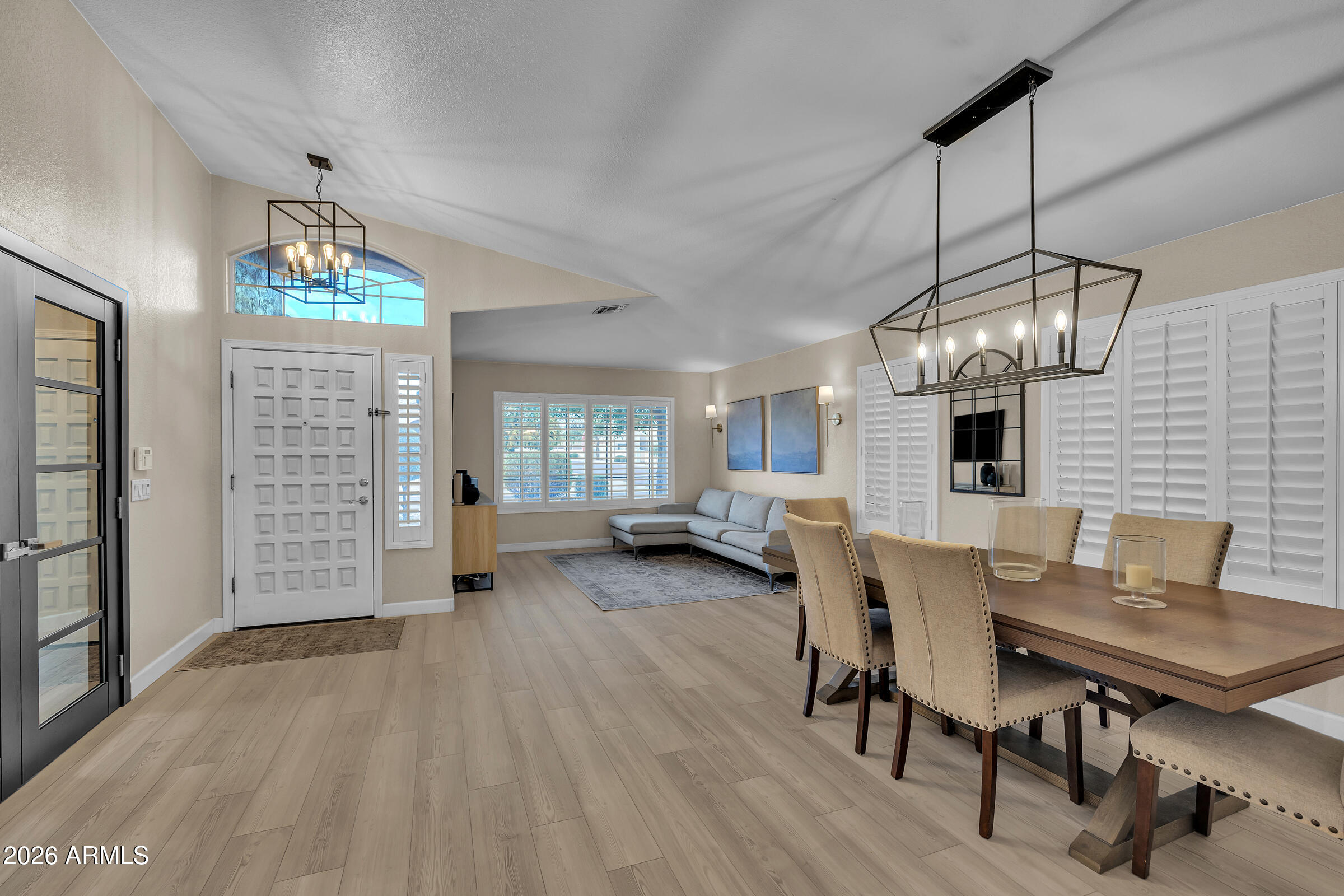 4629 East Gold Poppy Way Phoenix, AZ 85044 - Photo 5 of 46 a view of a livingroom with furniture window and wooden floor