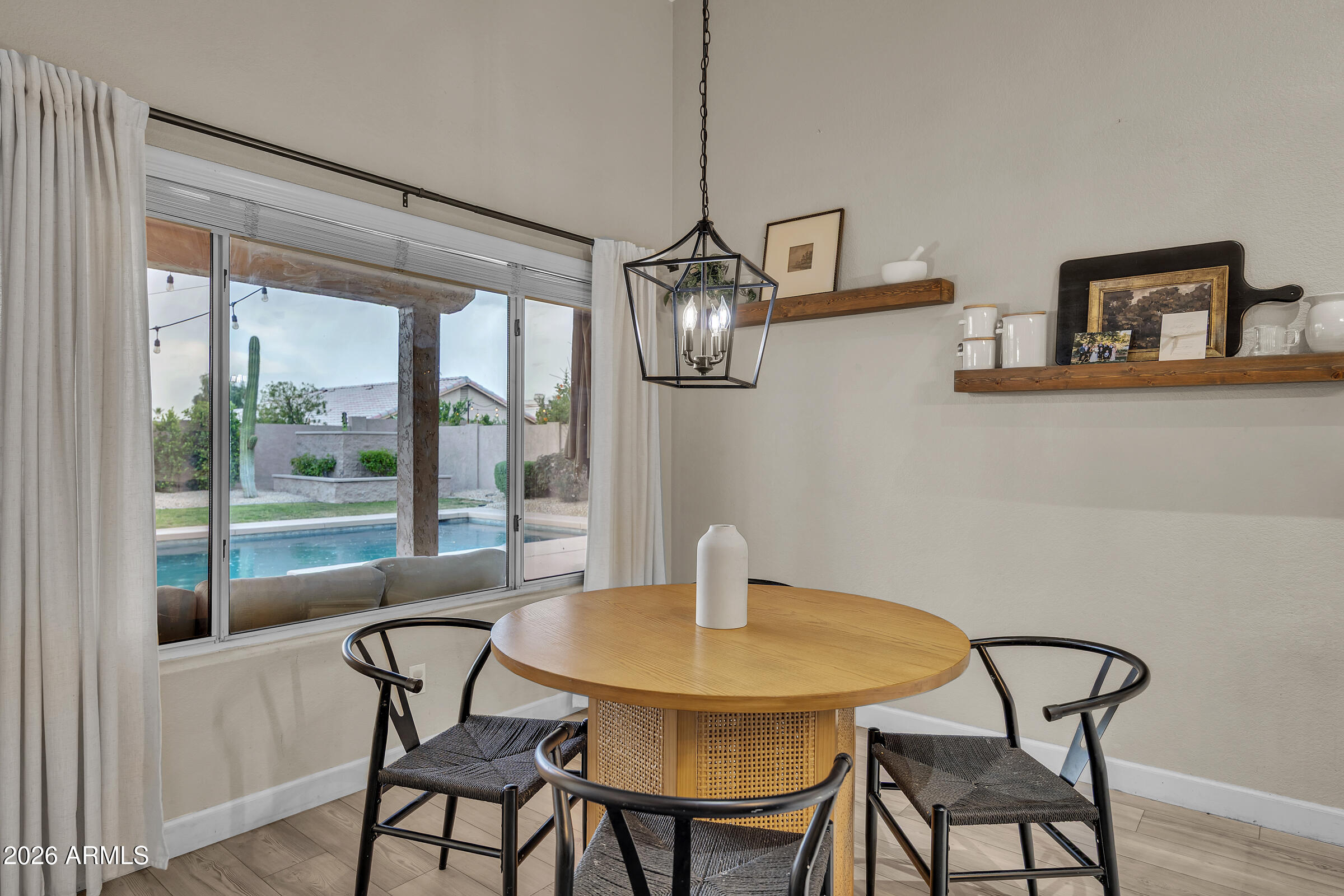 4629 East Gold Poppy Way Phoenix, AZ 85044 - Photo 10 of 46 a view of a dining room with furniture window and outside view