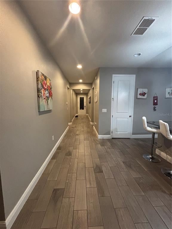 1222 Yorkshire Court Davenport, FL 33896 - Photo 16 of 17 an entryway of a house with wooden floor