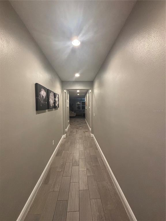 1222 Yorkshire Court Davenport, FL 33896 - Photo 7 of 17 a view of hallway with a large window