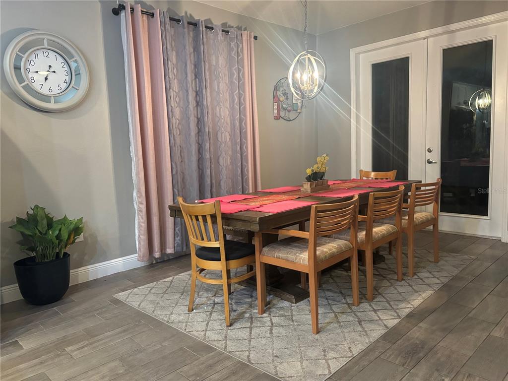1222 Yorkshire Court Davenport, FL 33896 - Photo 10 of 17 a dining room with furniture and window