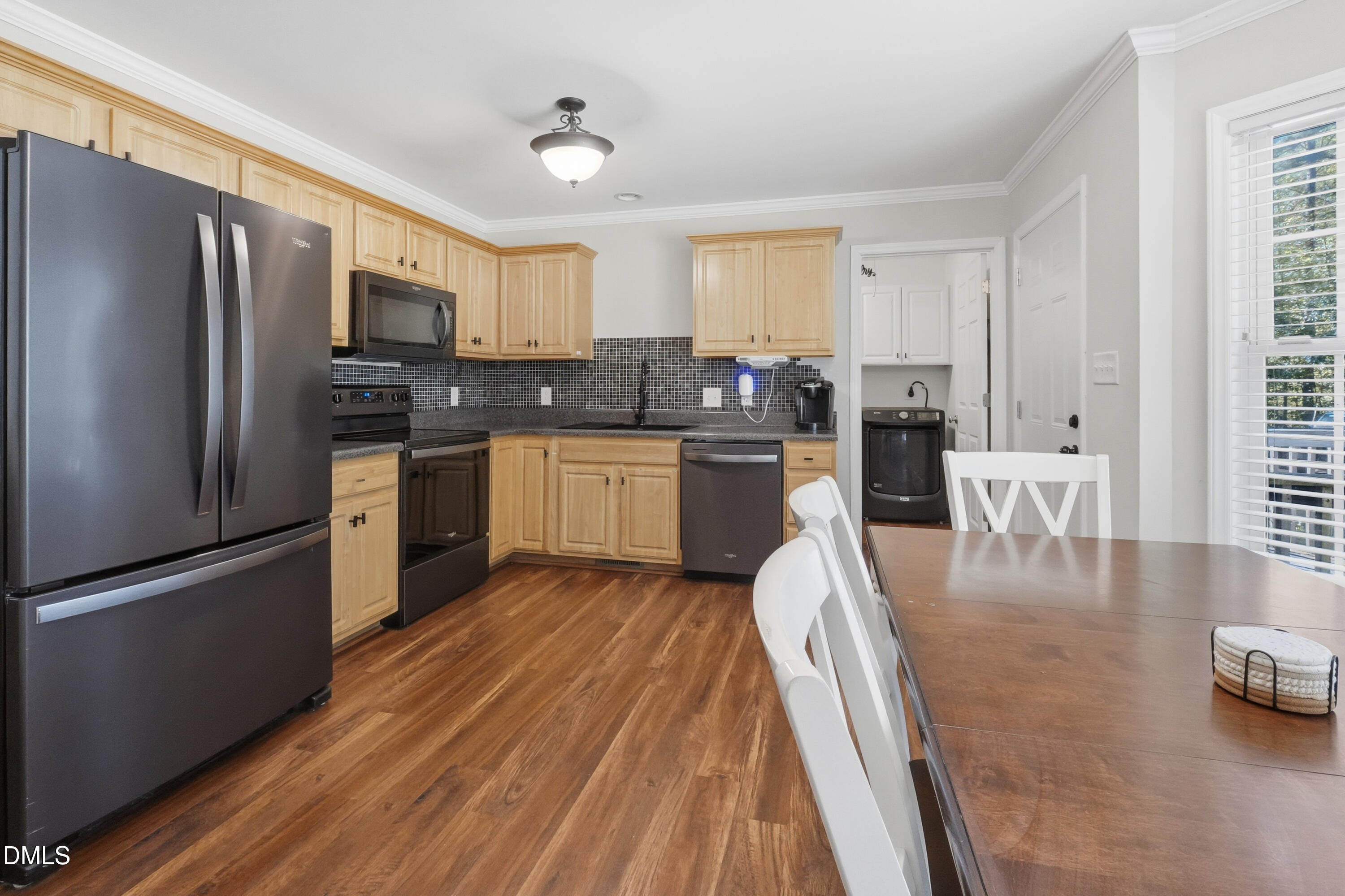 2097 Satterwhite Road Oxford, NC 27565 - Photo 11 of 40 a kitchen with stainless steel appliances granite countertop a refrigerator a stove and a sink