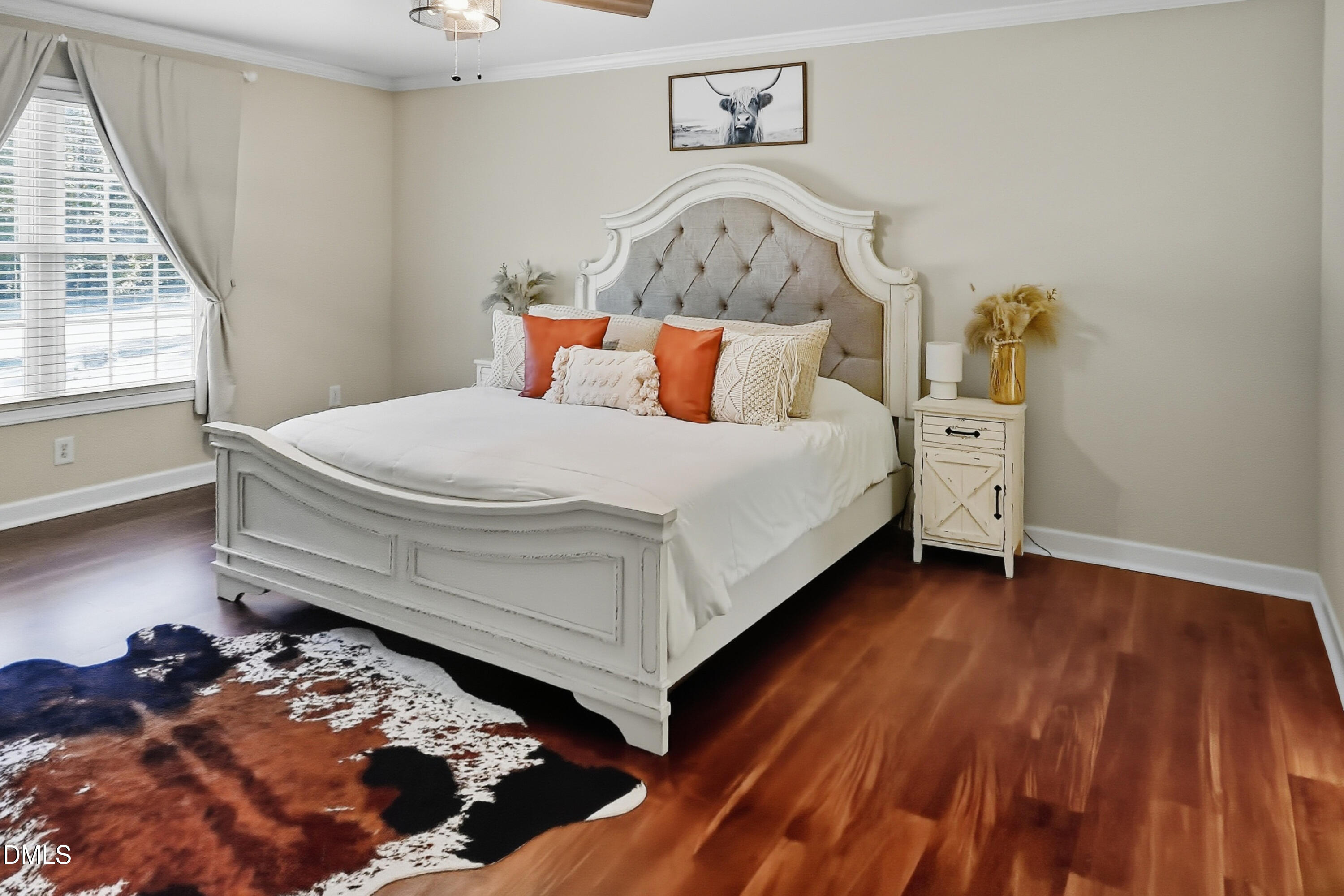 2097 Satterwhite Road Oxford, NC 27565 - Photo 15 of 40 a bed sitting in a bedroom next to a window