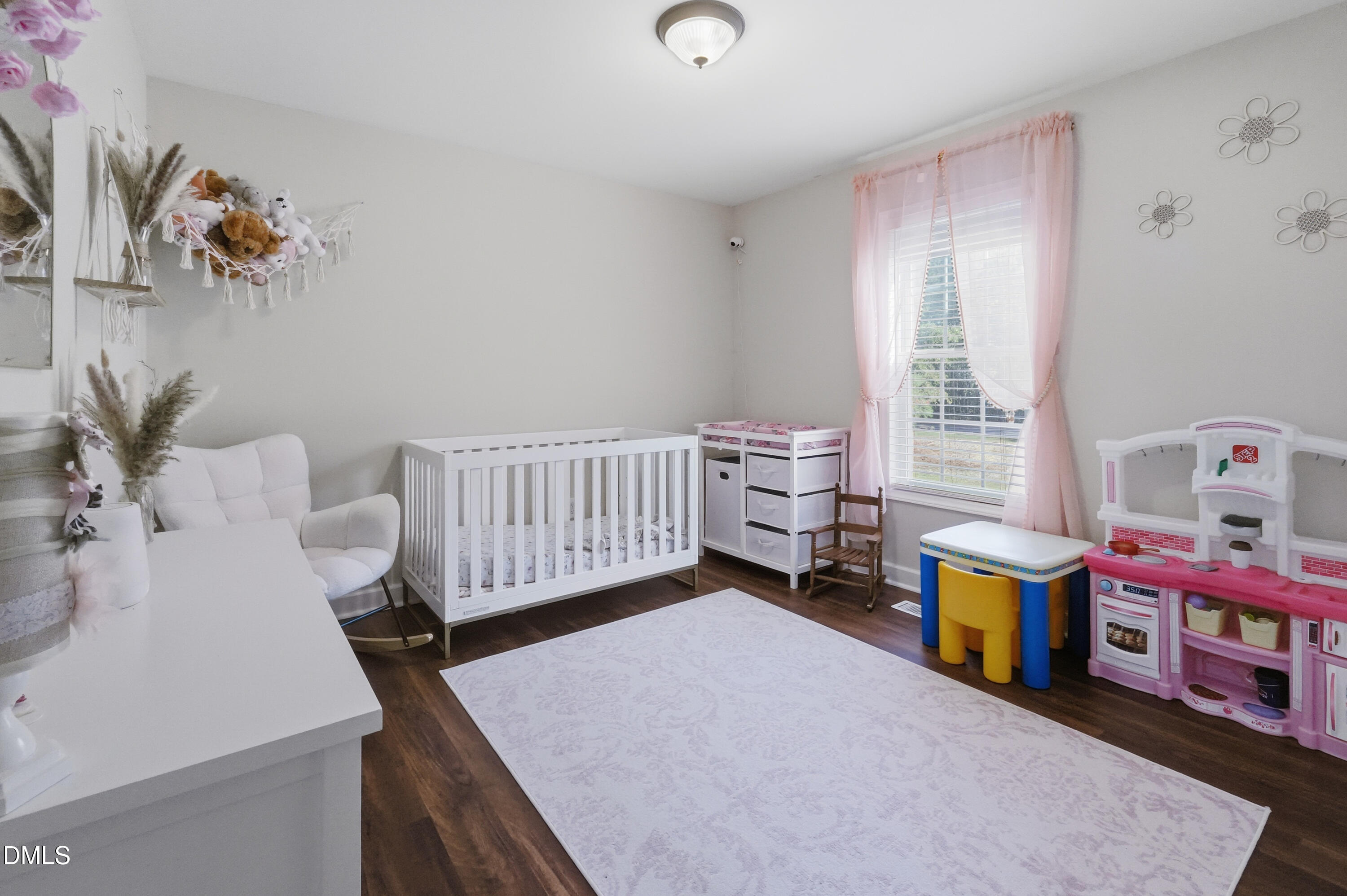 2097 Satterwhite Road Oxford, NC 27565 - Photo 19 of 40 a bedroom with baby toys and a window