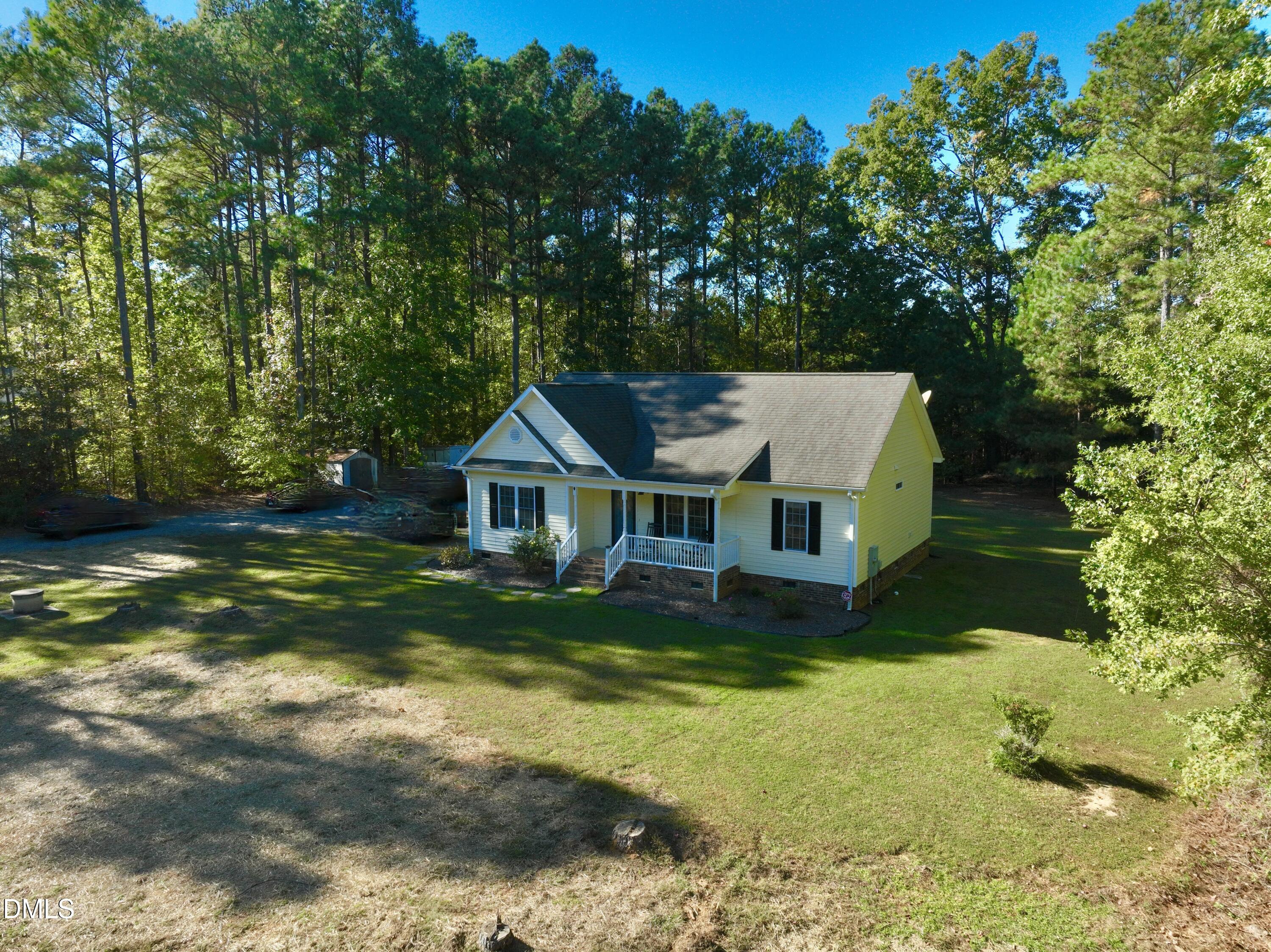 2097 Satterwhite Road Oxford, NC 27565 - Photo 22 of 40 a front view of a house with yard and green space