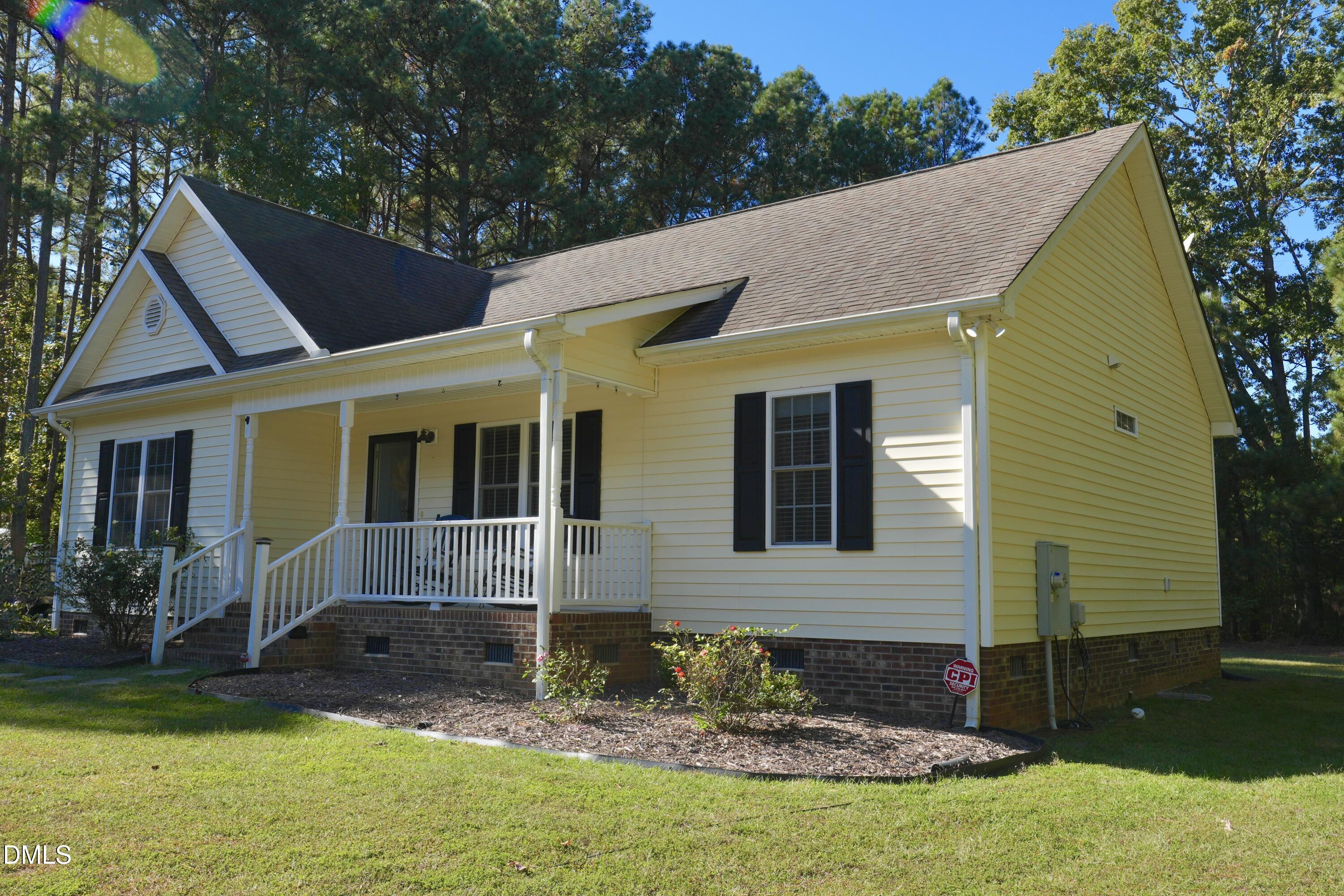 2097 Satterwhite Road Oxford, NC 27565 - Photo 3 of 40 a view of house with garden and swimming pool
