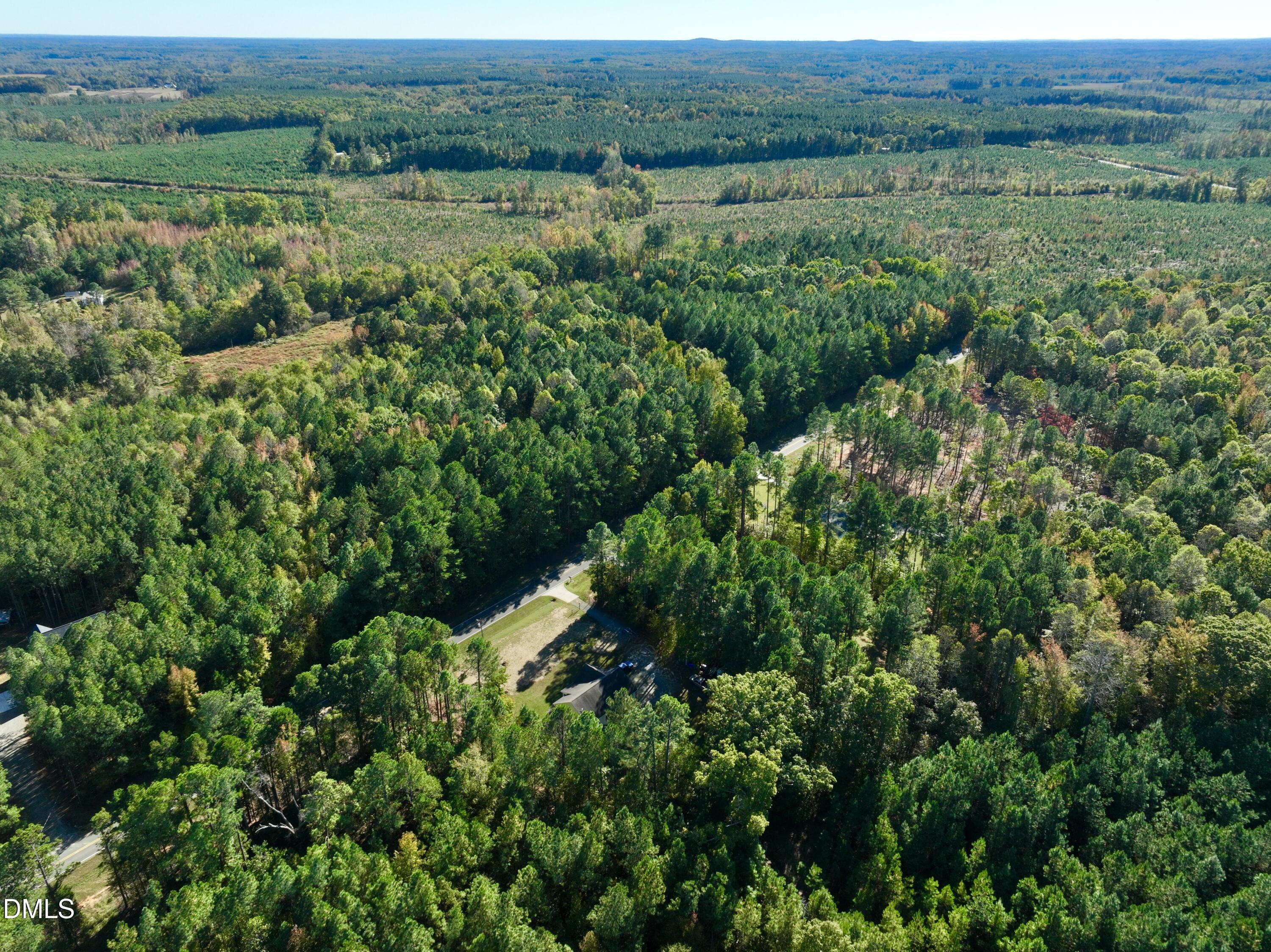 2097 Satterwhite Road Oxford, NC 27565 - Photo 33 of 40 an aerial view of green landscape with trees