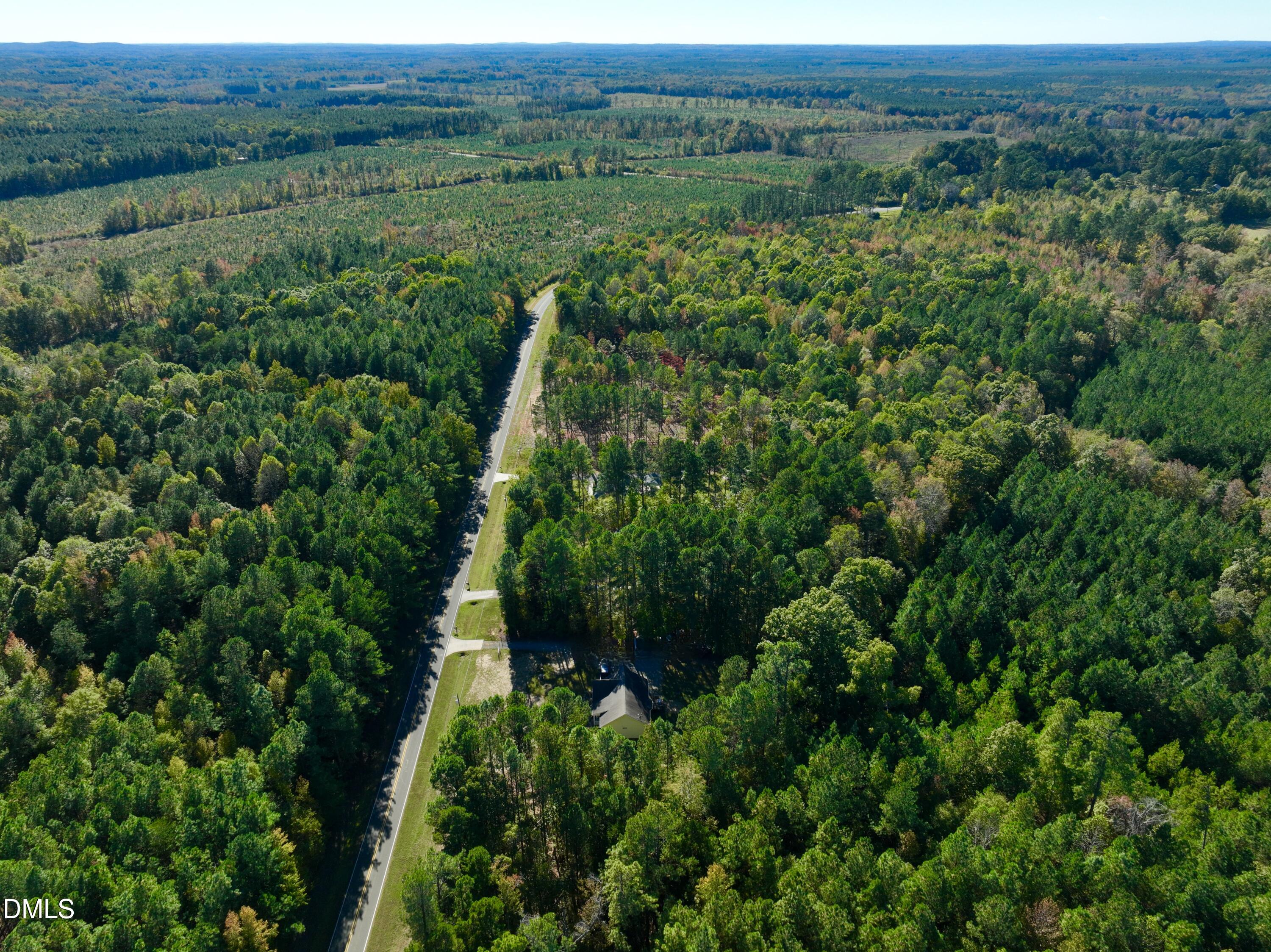 2097 Satterwhite Road Oxford, NC 27565 - Photo 36 of 40 an aerial view of green landscape with trees