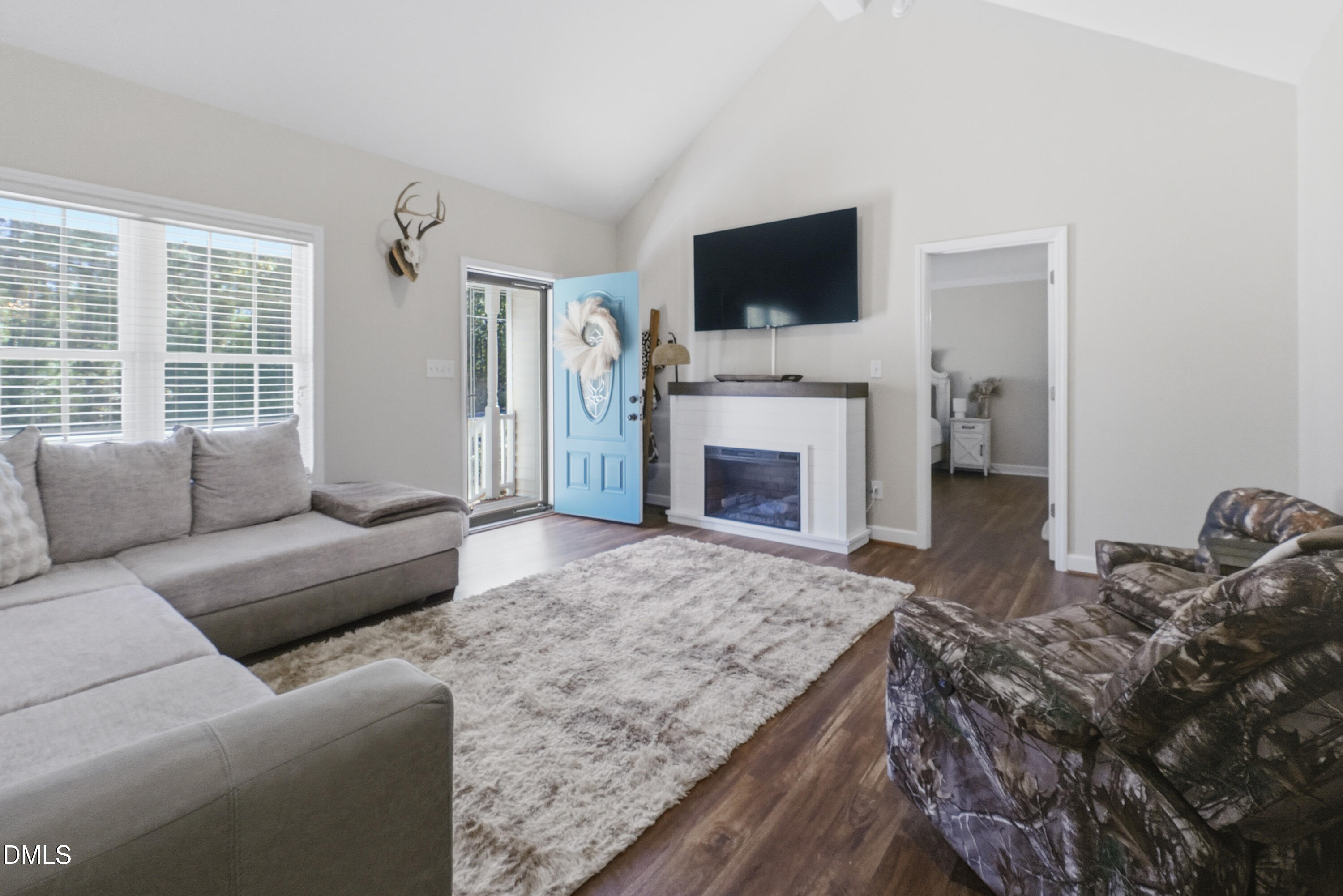2097 Satterwhite Road Oxford, NC 27565 - Photo 4 of 40 a living room with furniture a fireplace and a flat screen tv