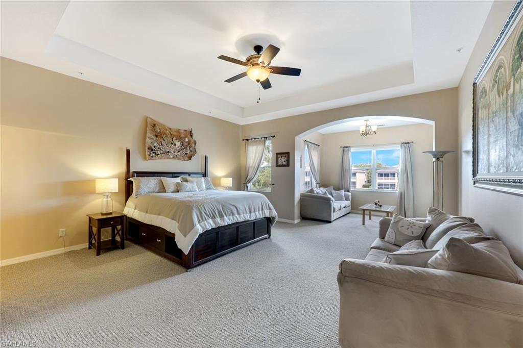 3530 Lansing Loop, Unit 202 Estero, FL 33928 - Photo 21 of 35 a bedroom with a bed couch and window