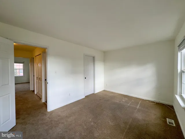 a view of an empty room and closet