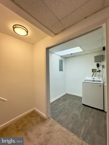 a view of utility room and closet