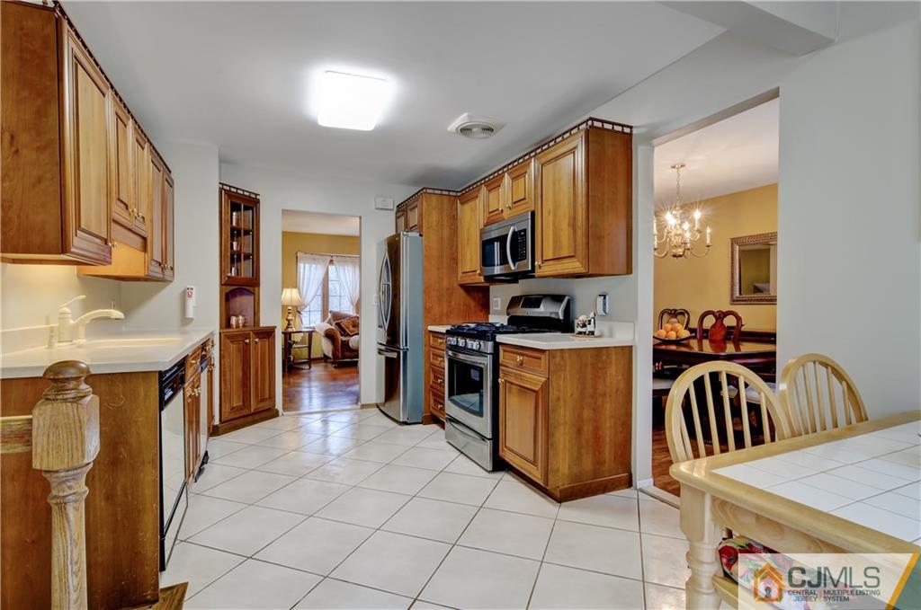 40 Meyer Road Edison, NJ 08817 - Photo 14 of 24 a kitchen with a refrigerator and a stove
